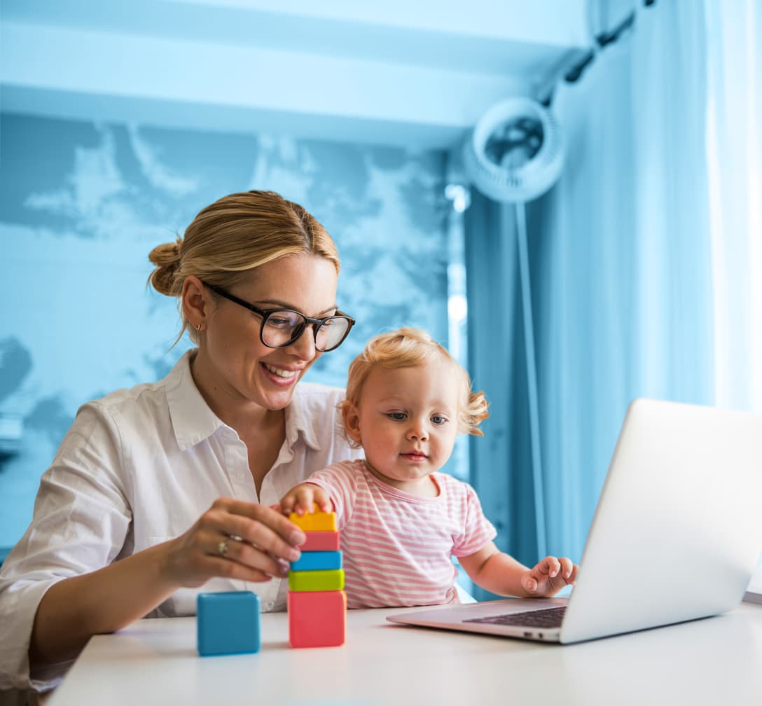 Parent and young child engaging in a telehealth session on a laptop, symbolizing accessible speech therapy support from home.