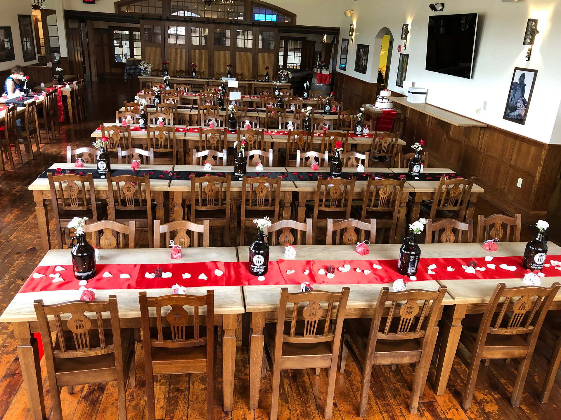 Long wooden tables set for a group event at Hofbräuhaus Columbus