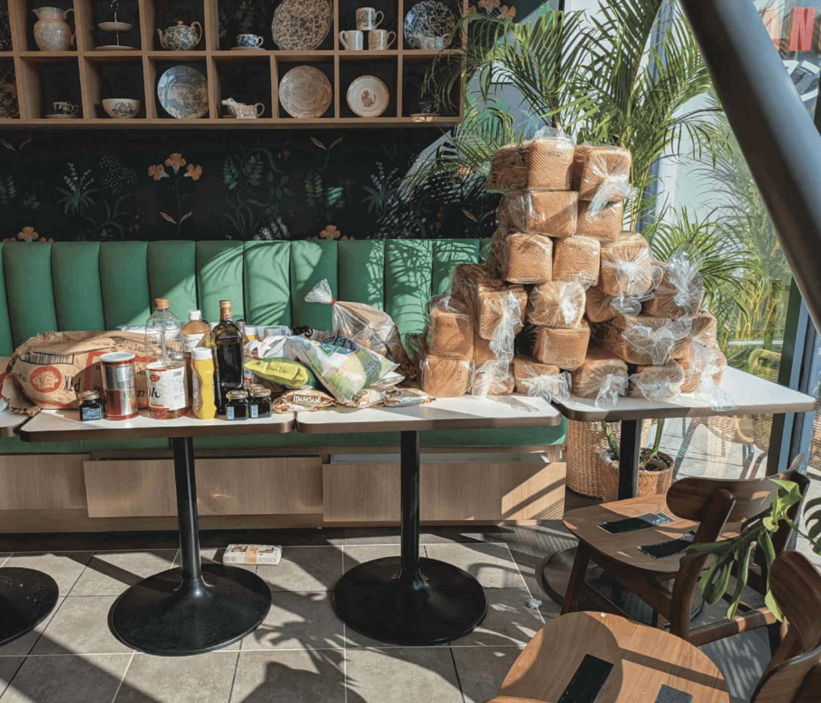 A table topped with lots of food on top of a wooden table