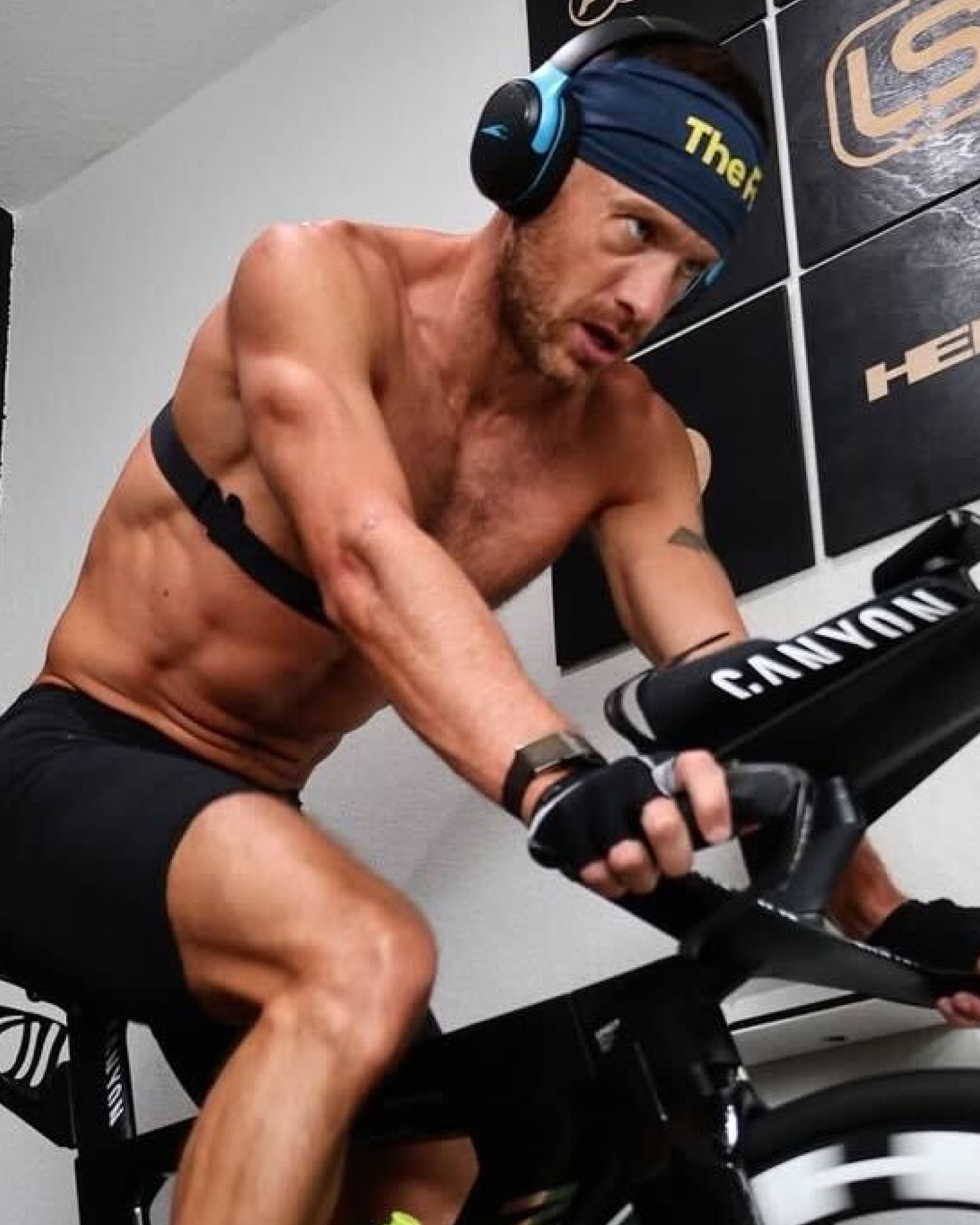 Lionel training intensely on an indoor bike.