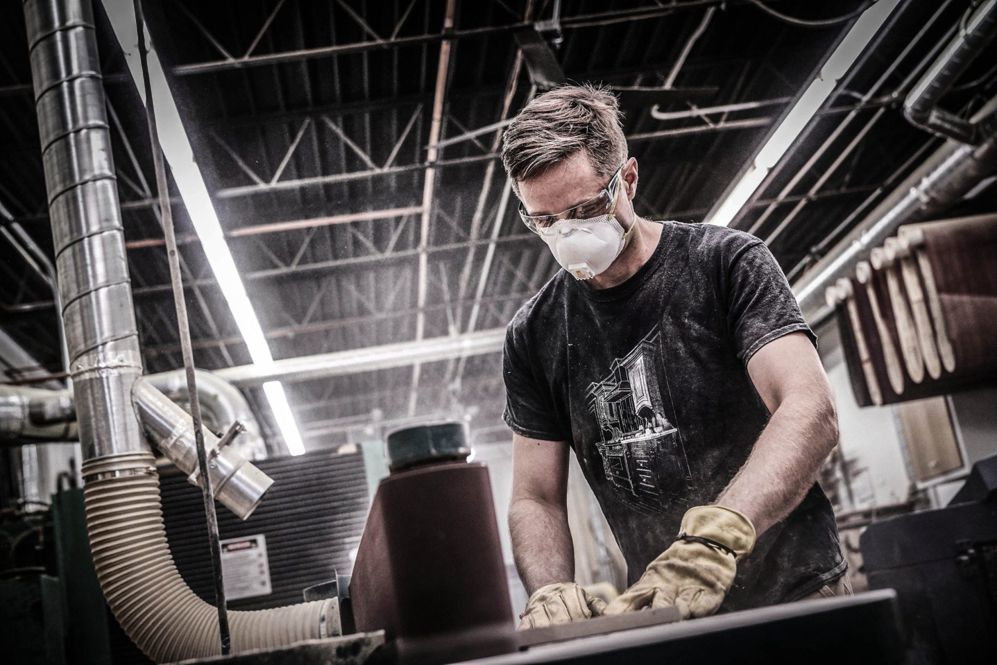 Professional wearing safety gear while in a workshop