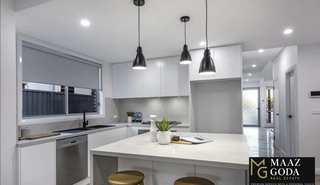 house interior with stairs and a tall window