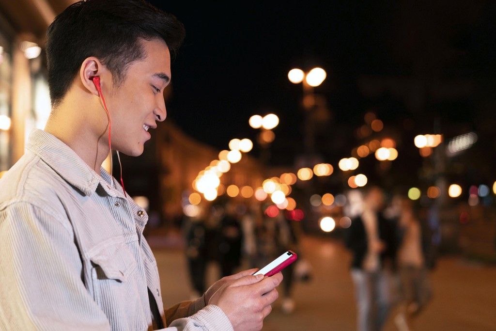 close up of man holding an iphone