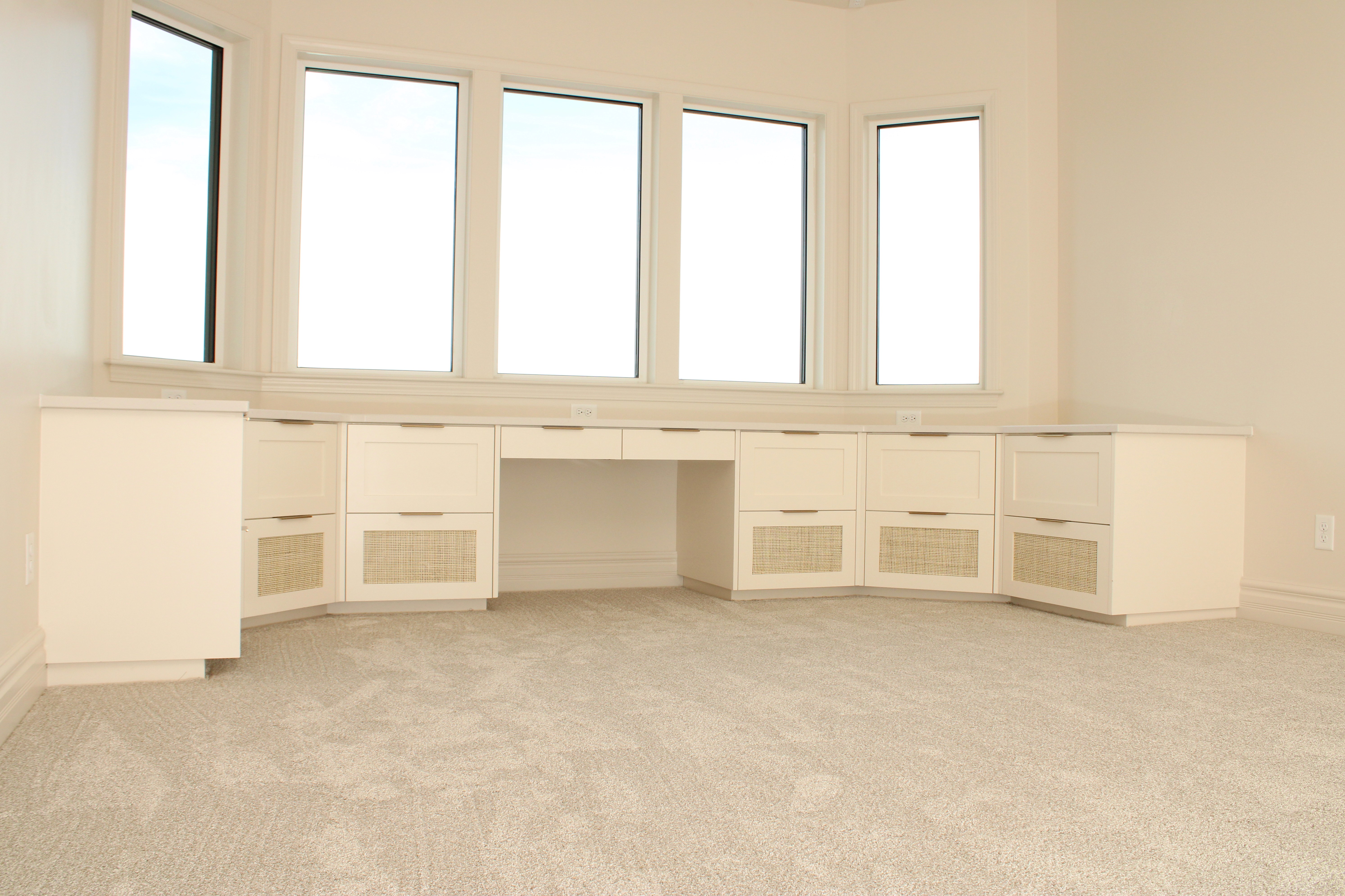 Work space with countertop, drawers, and abundant natural light in a St. George, Utah custom home.