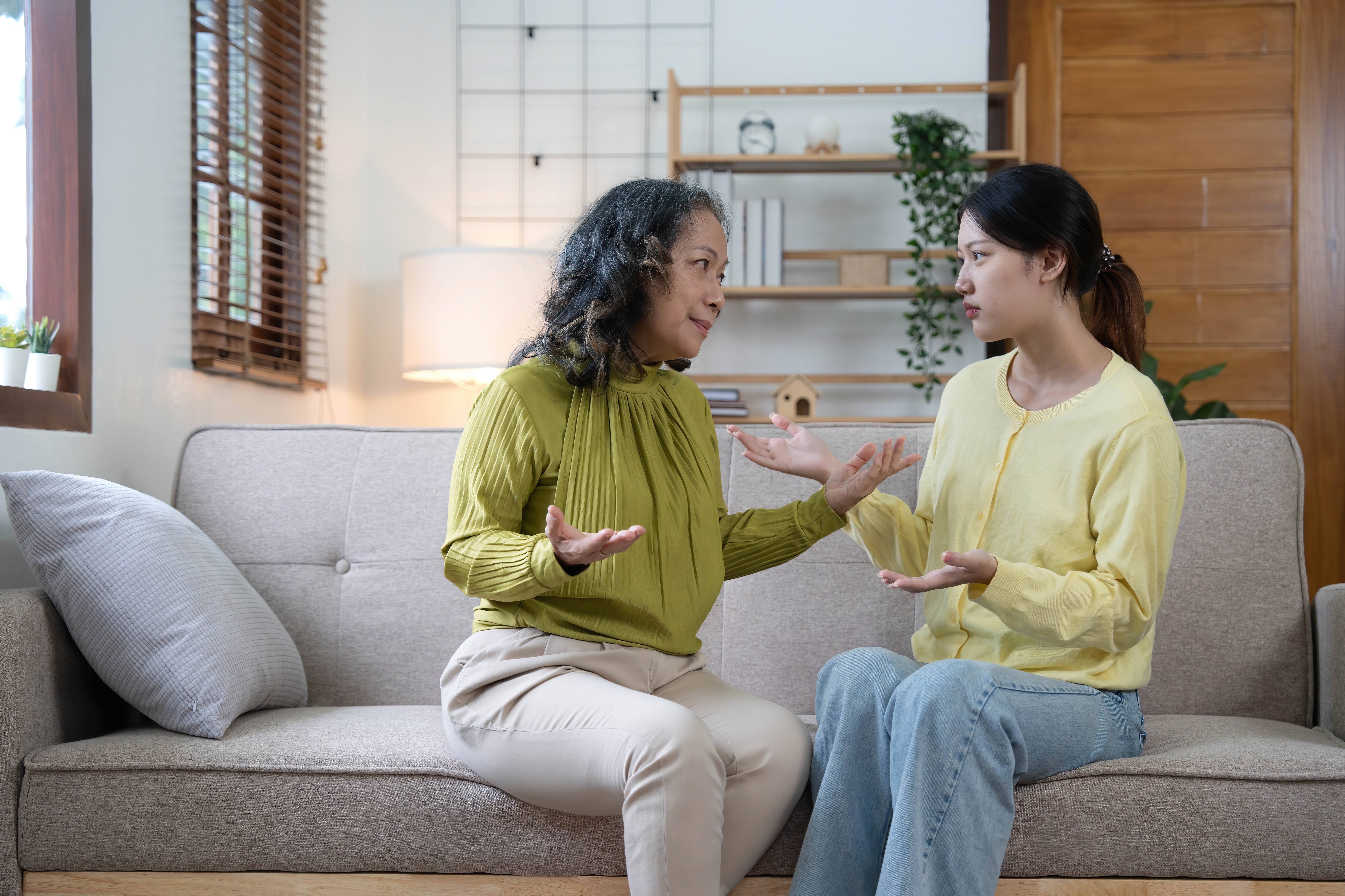 Filipino mom and daughter having a serious conversation about PCOS