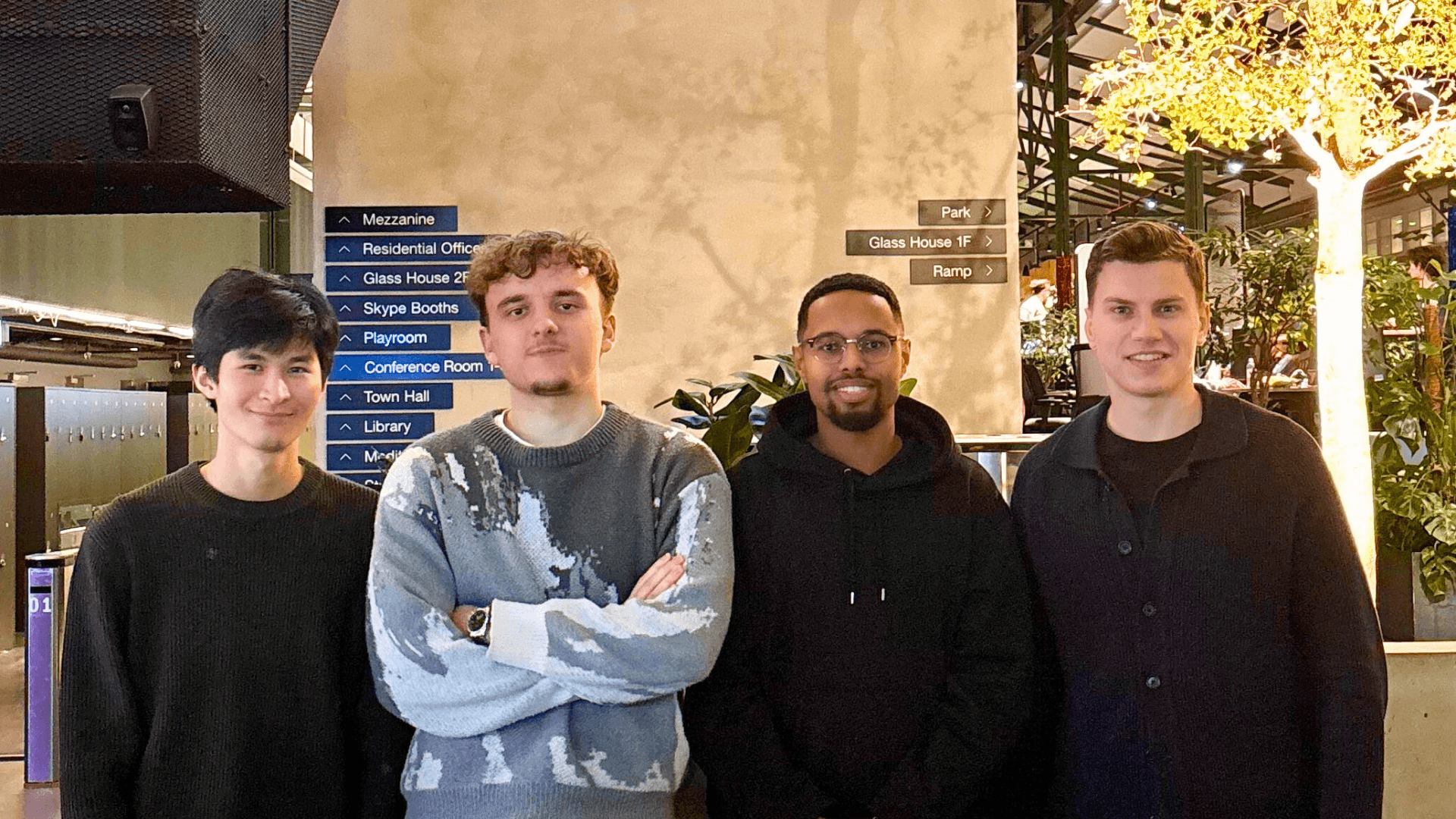 woman holding a phone and man looking at the phone. both are smiling