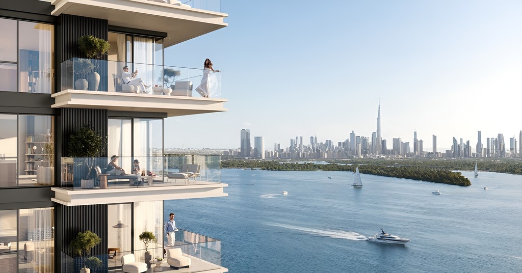  Sunset view of the oceanfront tower at Creek Bay Emaar Properties, with warm hues casting over the sea.