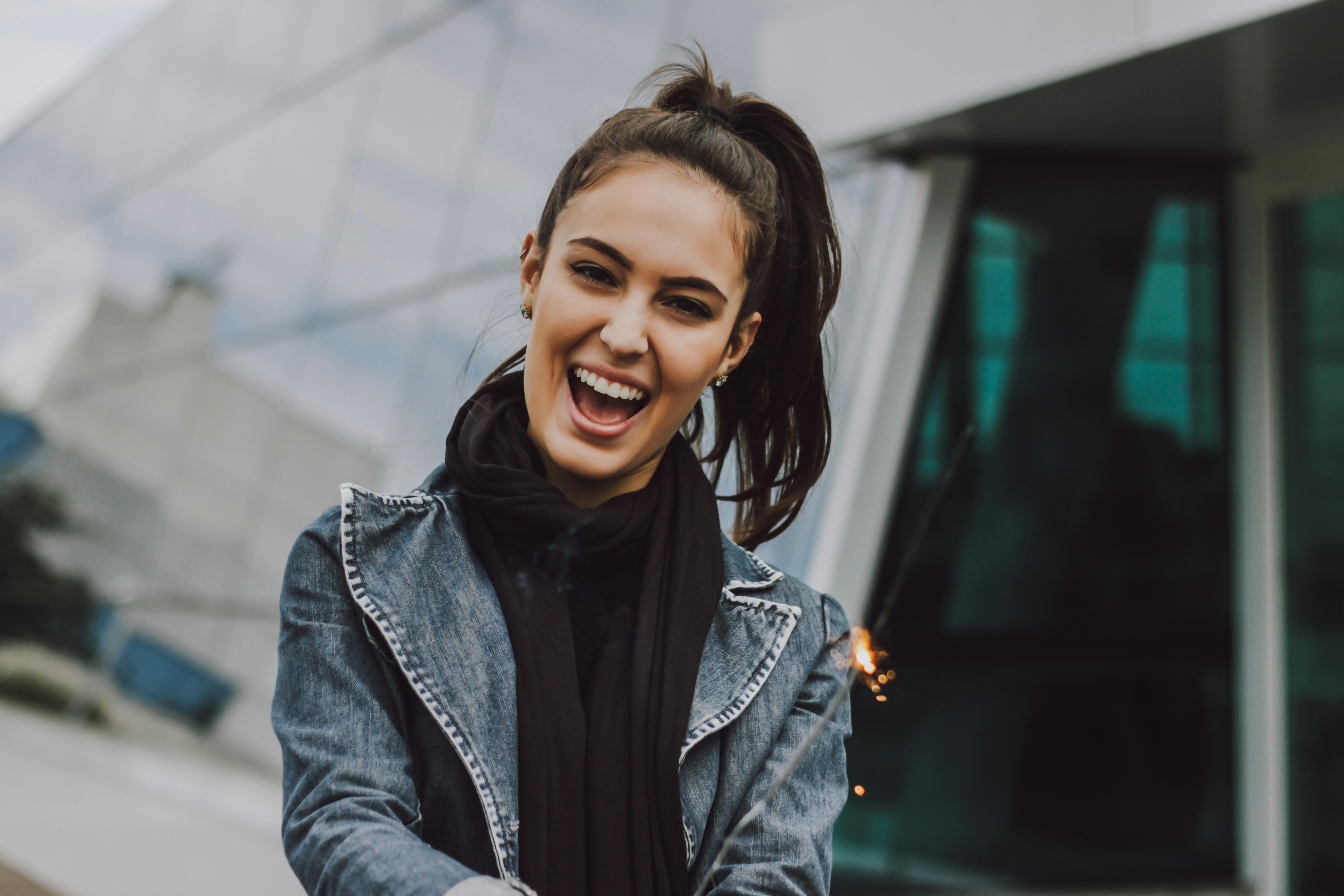 person in denim jacket smiling - Sales Mindset