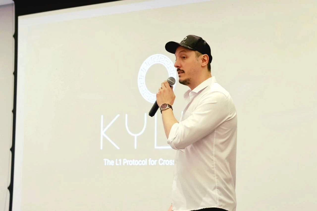 Man speaking at a conference presentation on the Kylin protocol