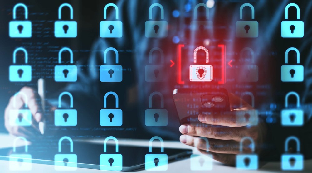 Red digital warning symbol glowing on a circuit board interface, representing active ransomware exploitation of the VMware ESXi CVE 2025 22225 vulnerability and hypervisor compromise.