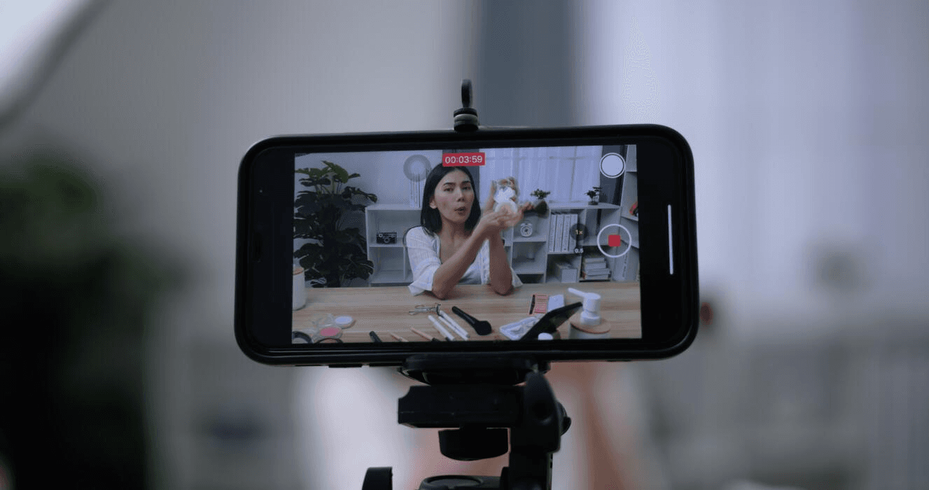 Woman recording video on phone - How to Create POV Videos