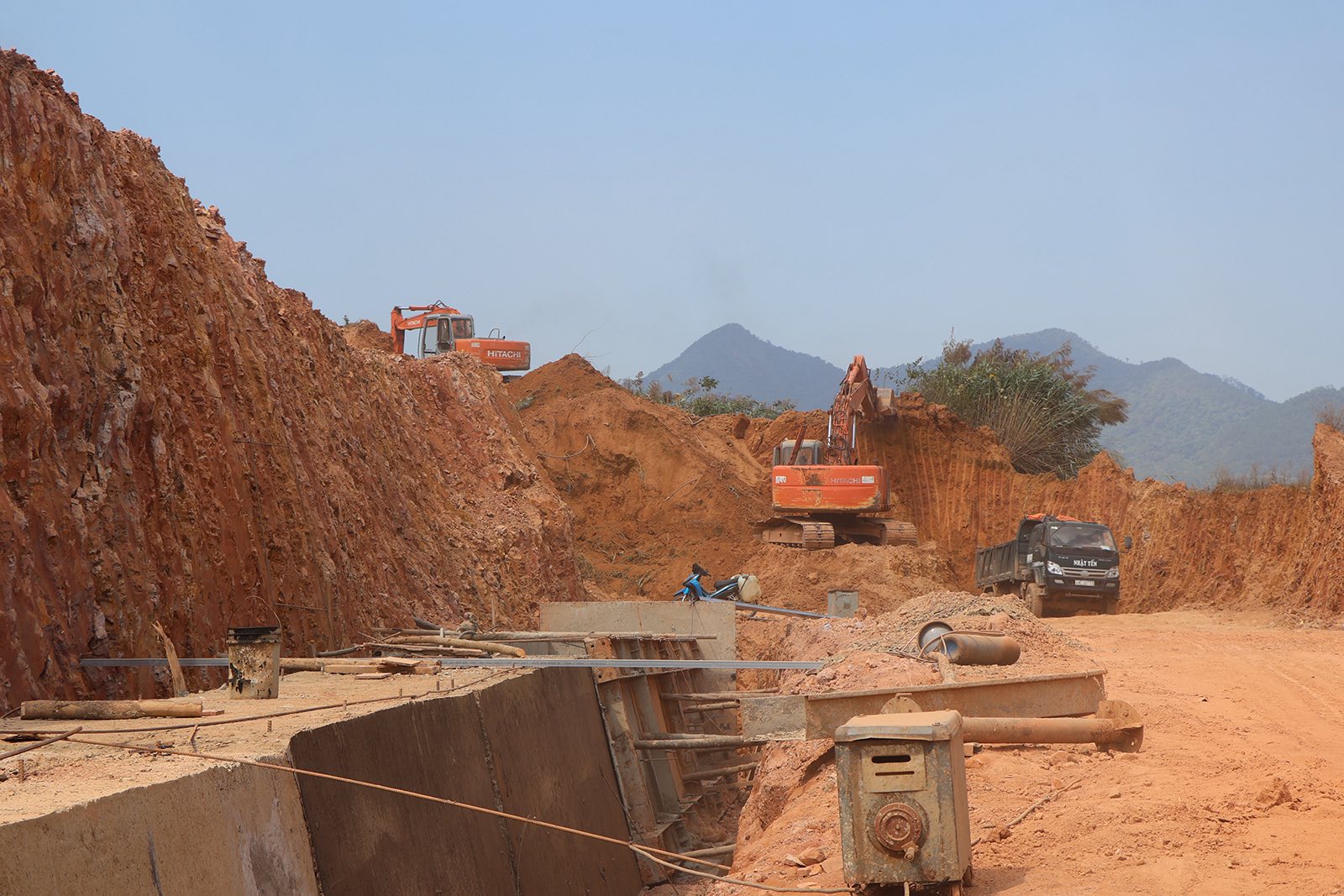Road paving machine laying asphalt on a street.