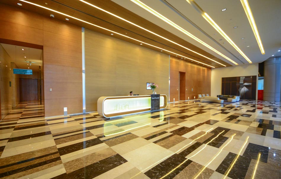 Elegant lobby reception area with modern lighting, perfect for showcasing professional real estate management.