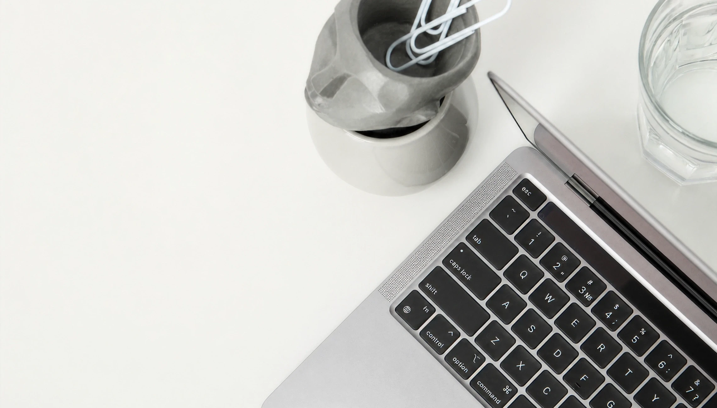 Modern workspace with laptop on wooden desk representing web design services