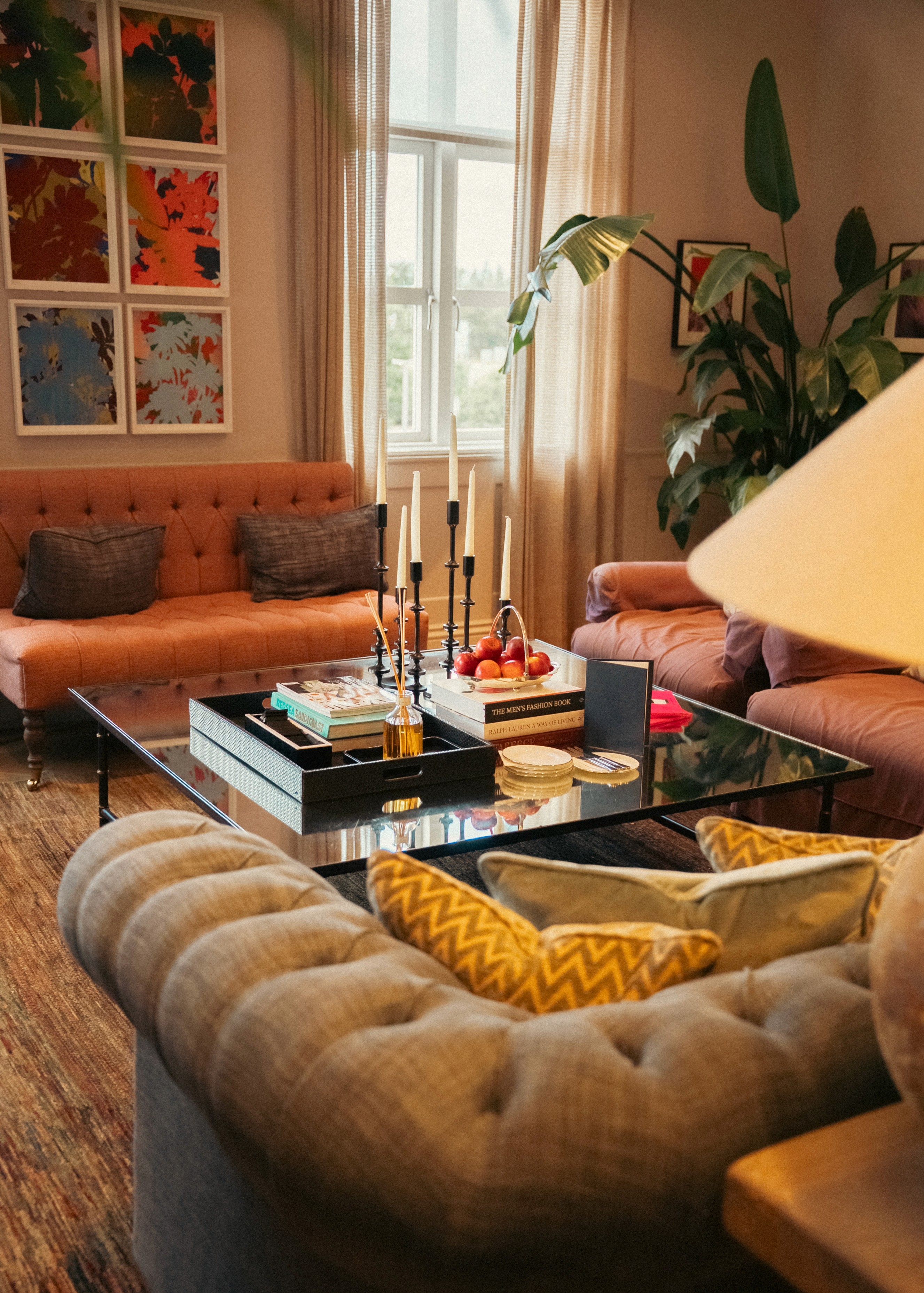 Close-up of a dark green leaf showing its textured surface and central vein against a muted background.