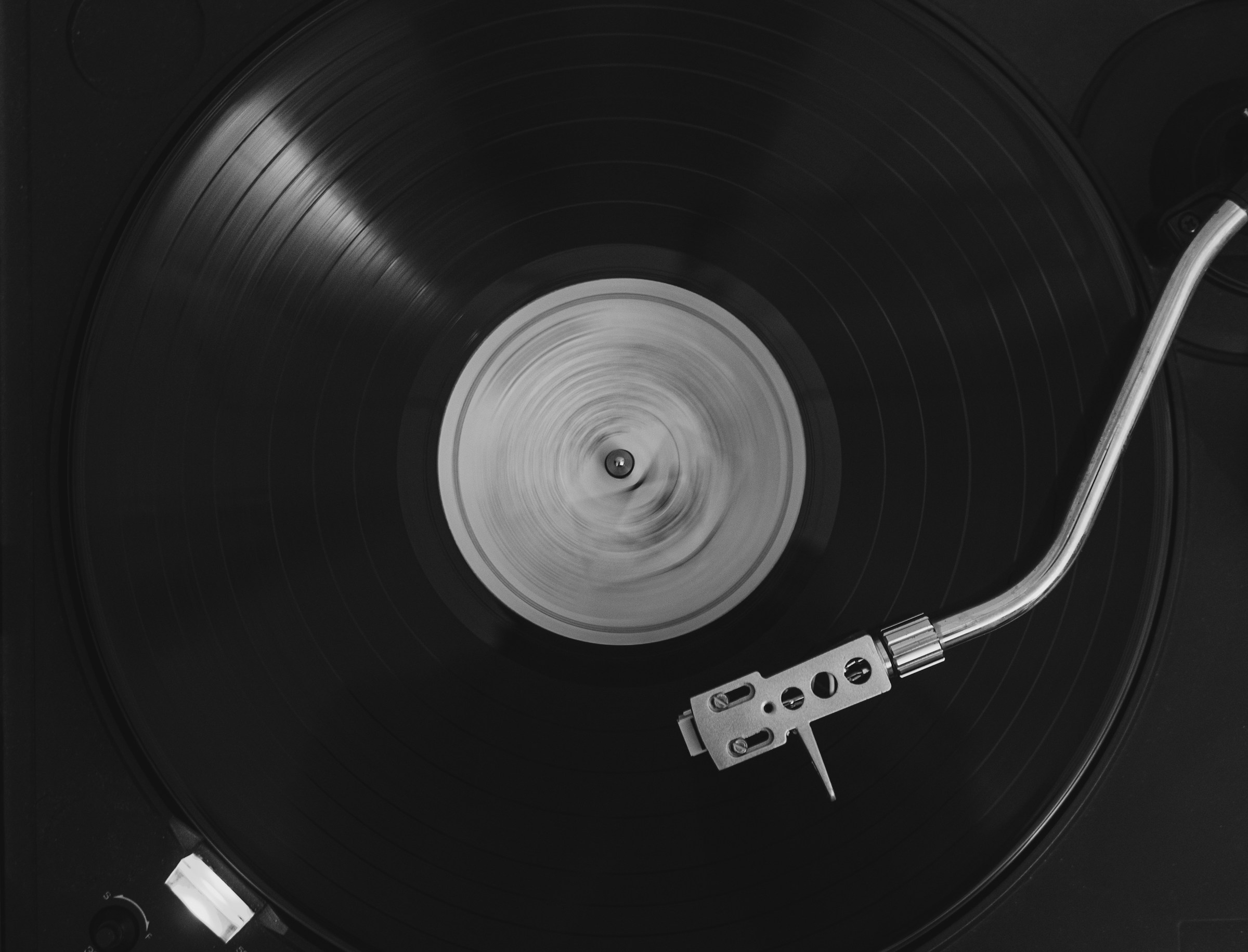 Close-up of a vinyl record playing on a turntable