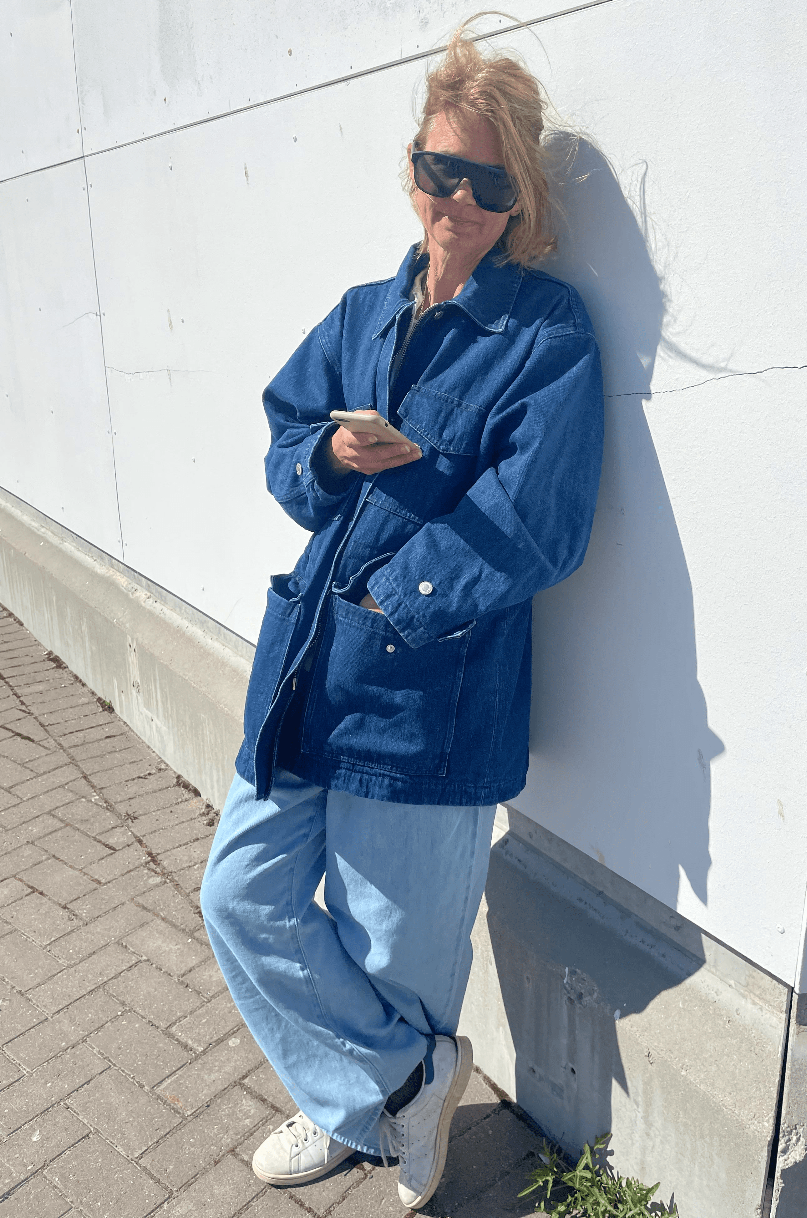 Girl standing in colorful pastel background