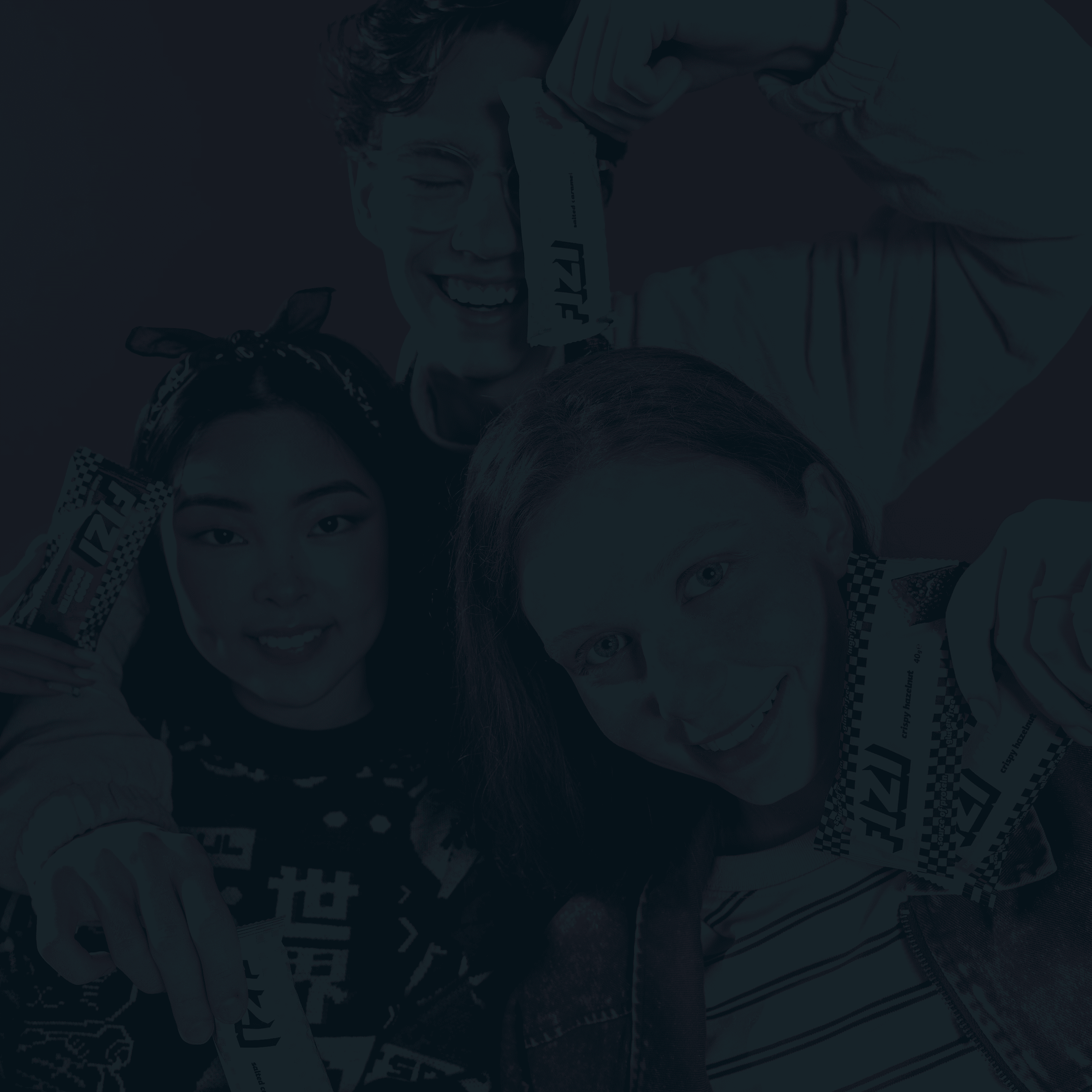 Three Young Adults Holding FIZI Bars