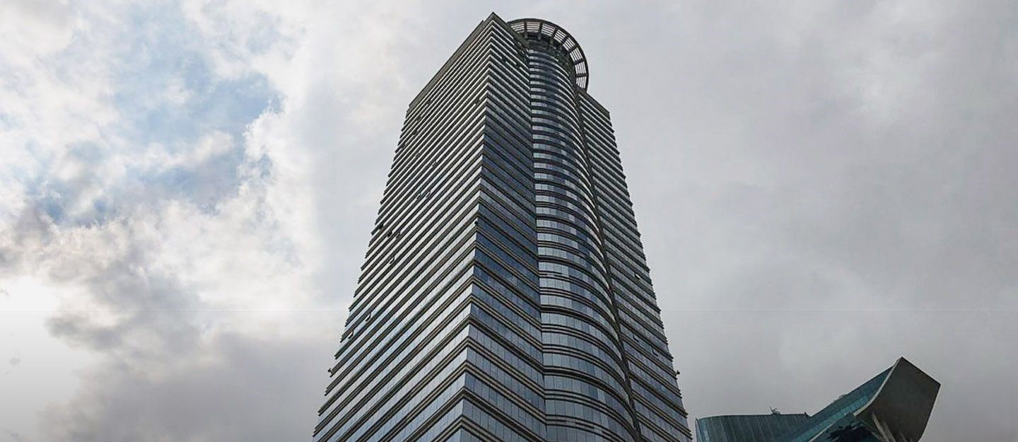 Exterior facade of The Citadel Tower against a bright sky, ideal for business office space.