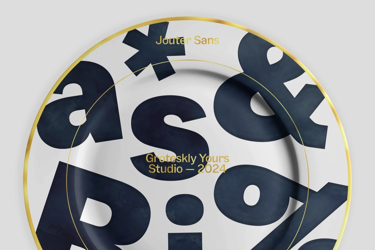 Dinner plate mockup displaying Jouter Sans characters, featuring classic gothic font letterforms