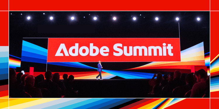 Image of someone presenting on stage in front of a crowd at Adobe Summit.
