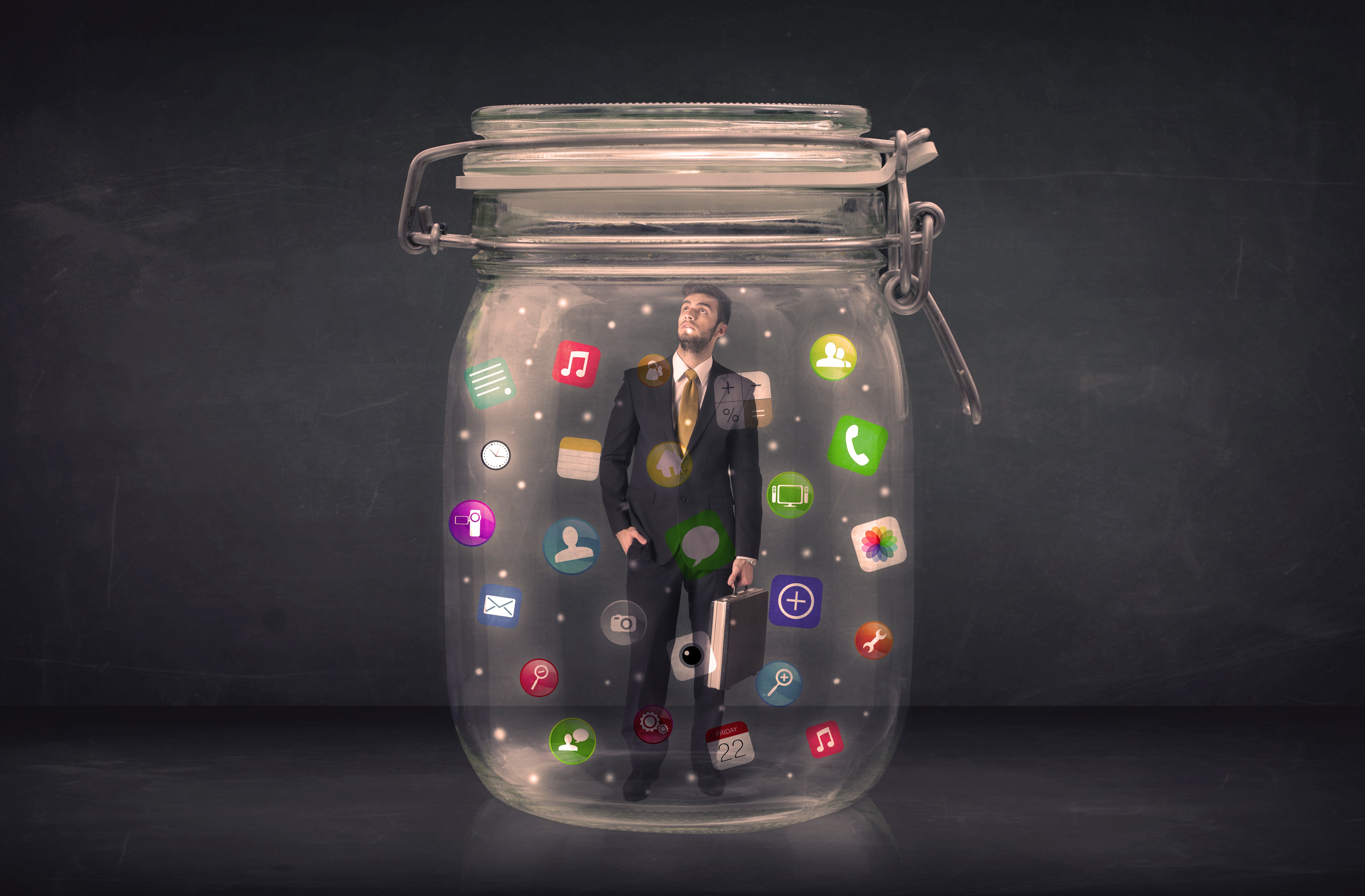 Service business owner trapped in a glass jar surrounded by marketing tools — illustrating why great businesses stay invisible without the right marketing system.