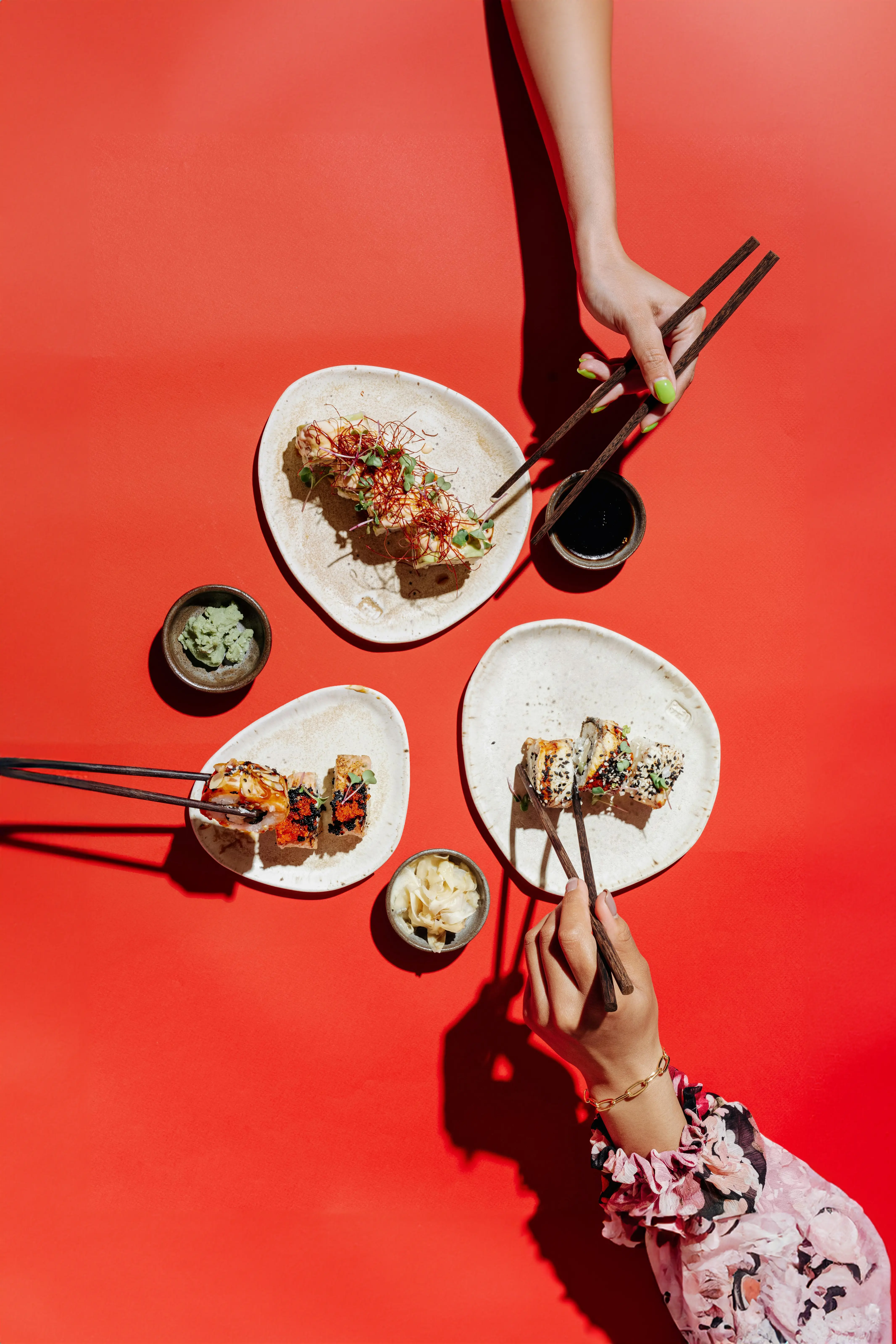 Top Down View of Two People Eating Sushi