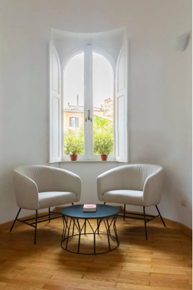 Unitas Italica, Italian family home interior with designer shelving, Rome.