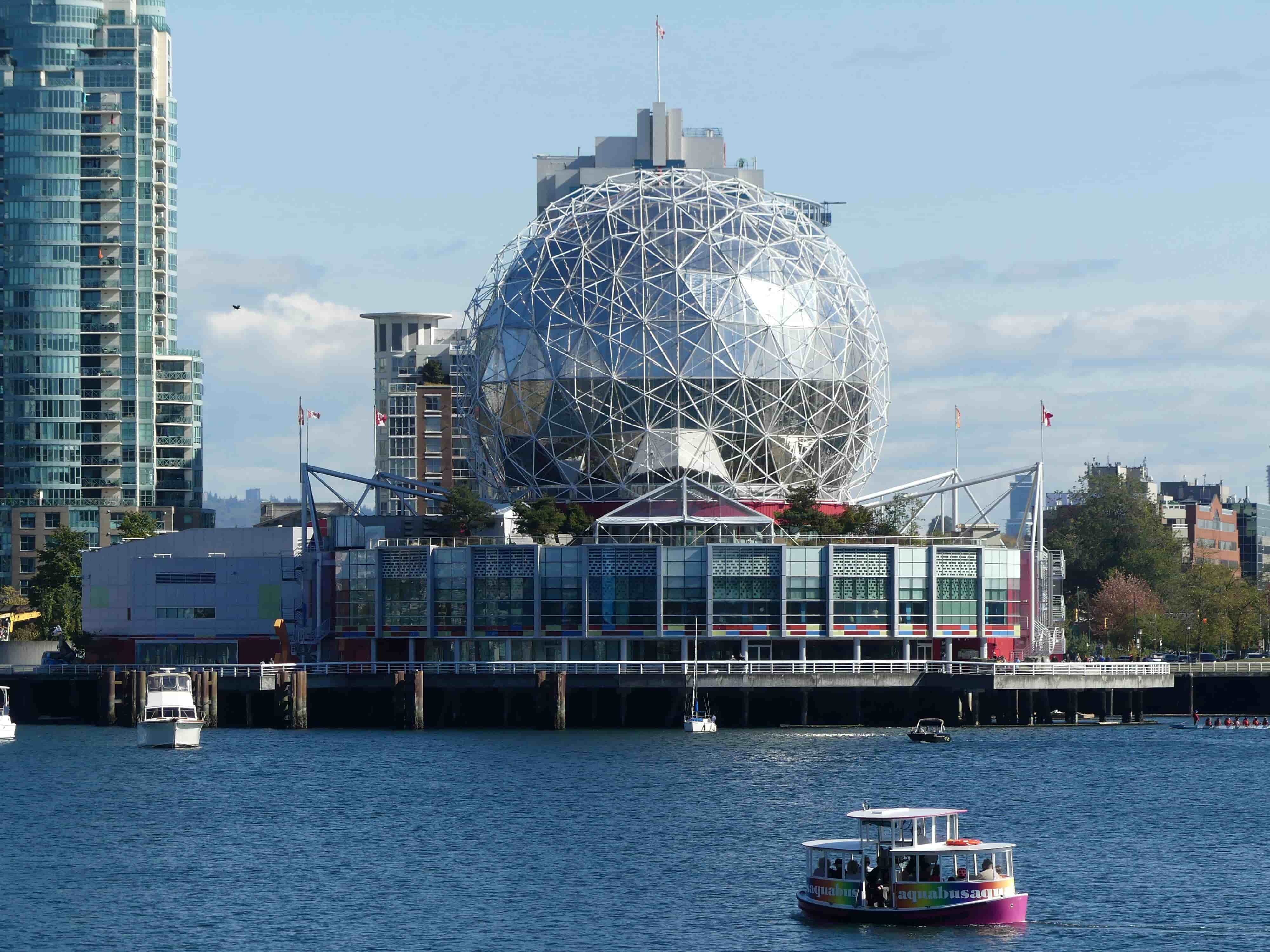 Public institutional building with geodesic dome on a waterfront in Vancouver