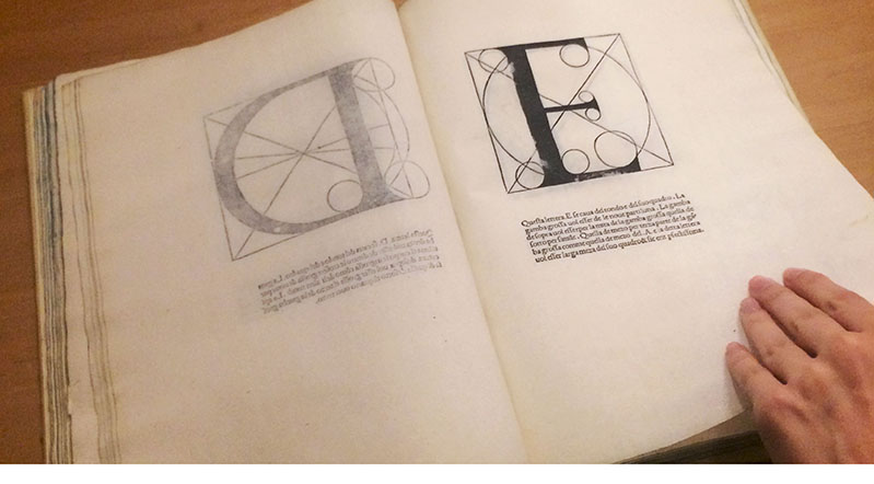 opened book with an letter E
