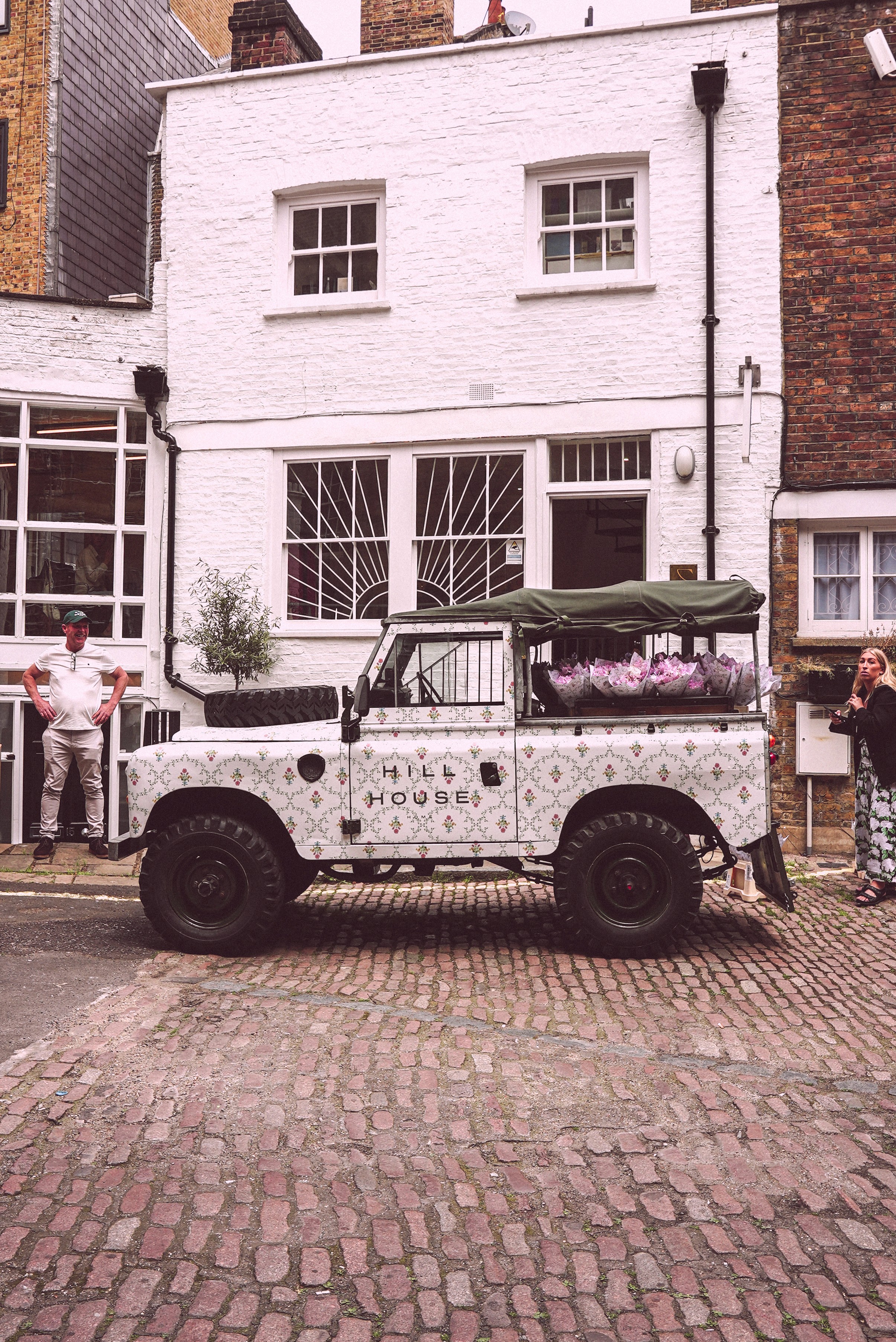 Bride and groom walking on street at night