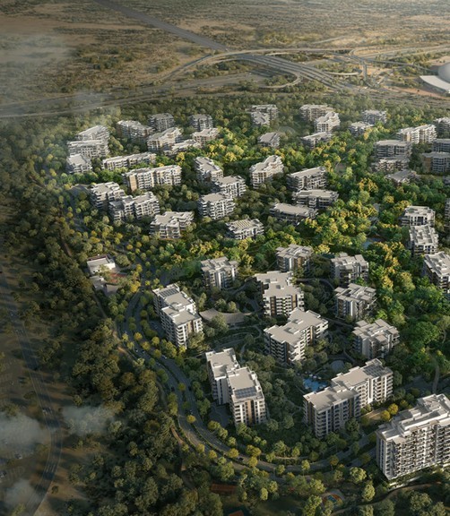 Luftaufnahme eines Wohnkomplexes mit Gebäuden, umgeben von grüner Vegetation.