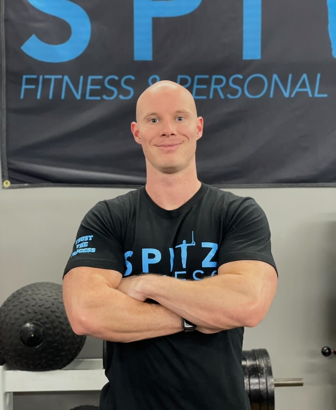 a woman in a black suit and sunglasses