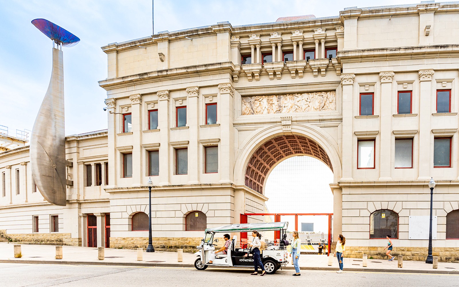 Tuk tuk tour passing by Sagrada Familia in Barcelona.