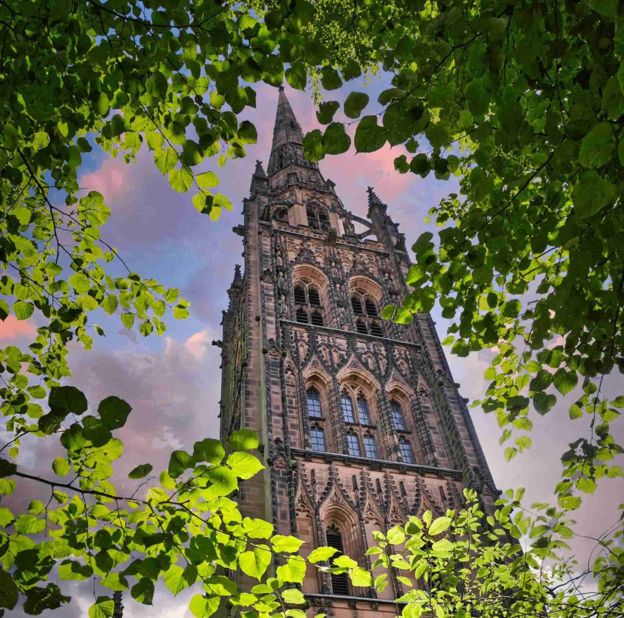 brown concrete church under cloudy sky