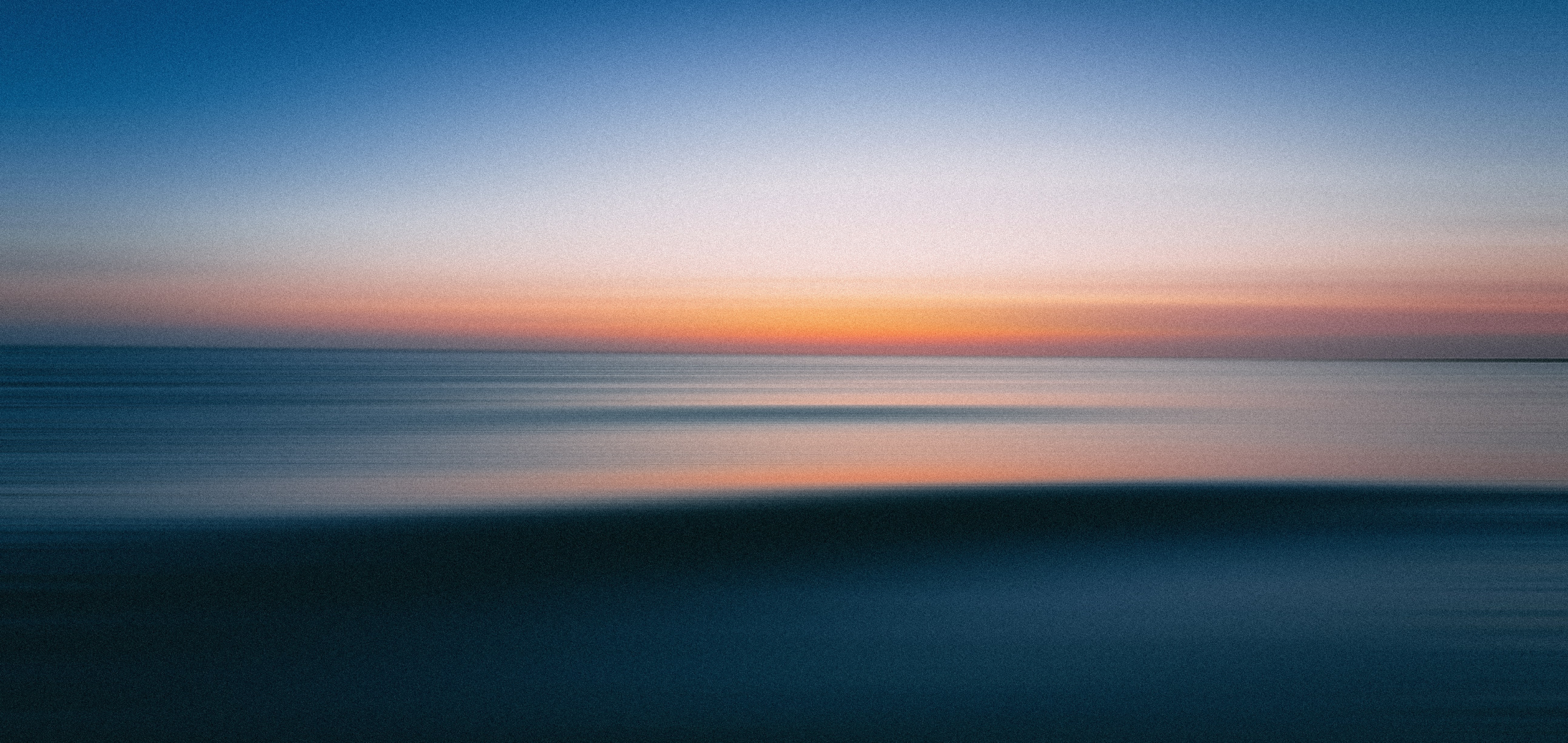 Calm ocean horizon at sunset symbolizing clarity and steady leadership