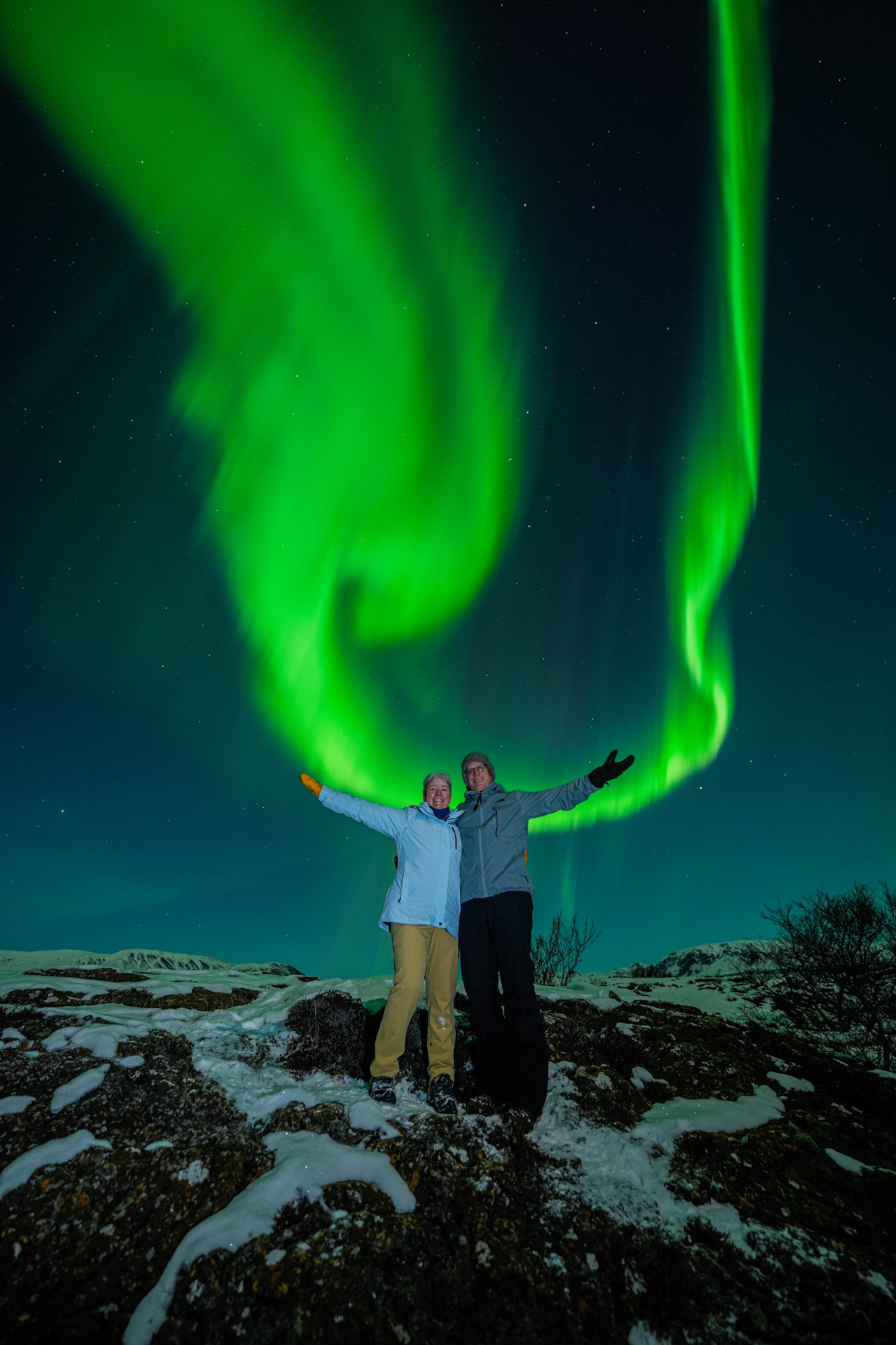 Northern Lights tour photography from Aurora Experts in Iceland, featuring guests beneath the aurora, winter landscapes, and vivid skies over remote Icelandic locations.