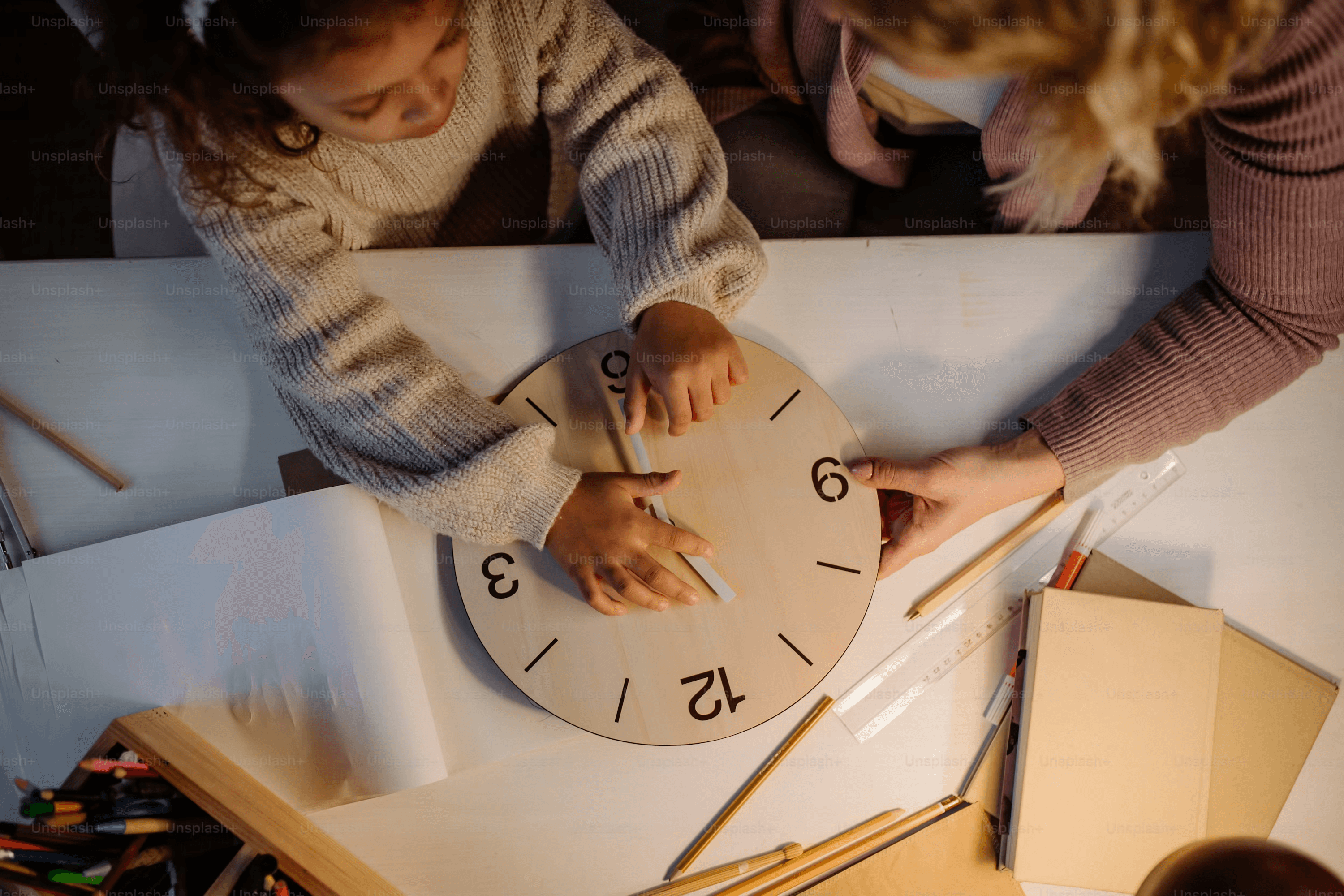High school student planning a research project timeline at a desk with notes and a calendar