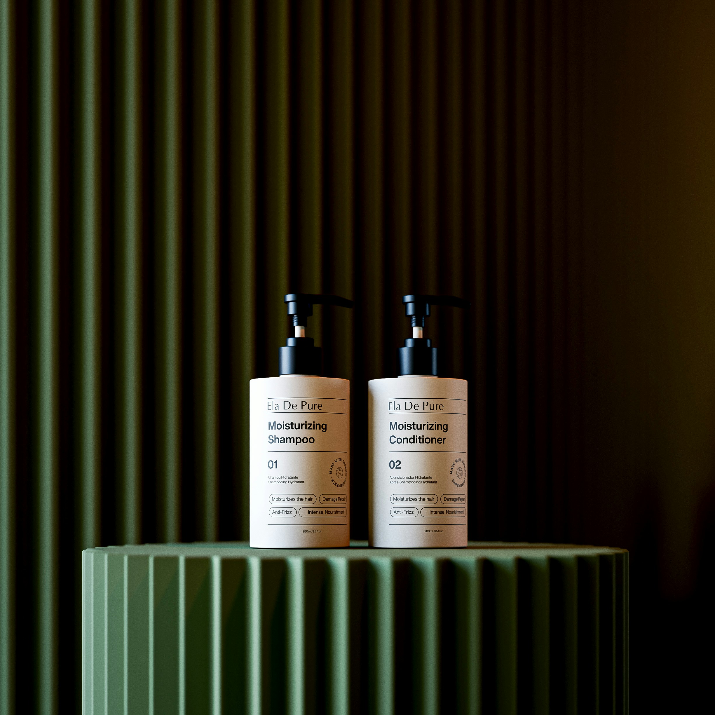 Two bottles of shampoo and conditioner on display.