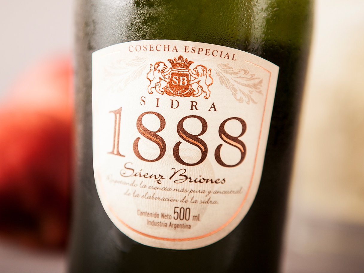 Rooftops of a coastal town with the sea in background