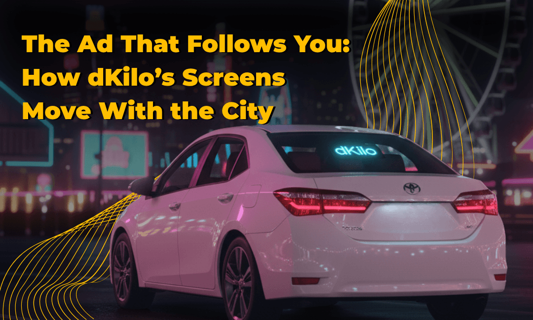 A dKilo-branded car driving through a city at night, illustrating mobile DOOH advertising that moves with urban traffic.