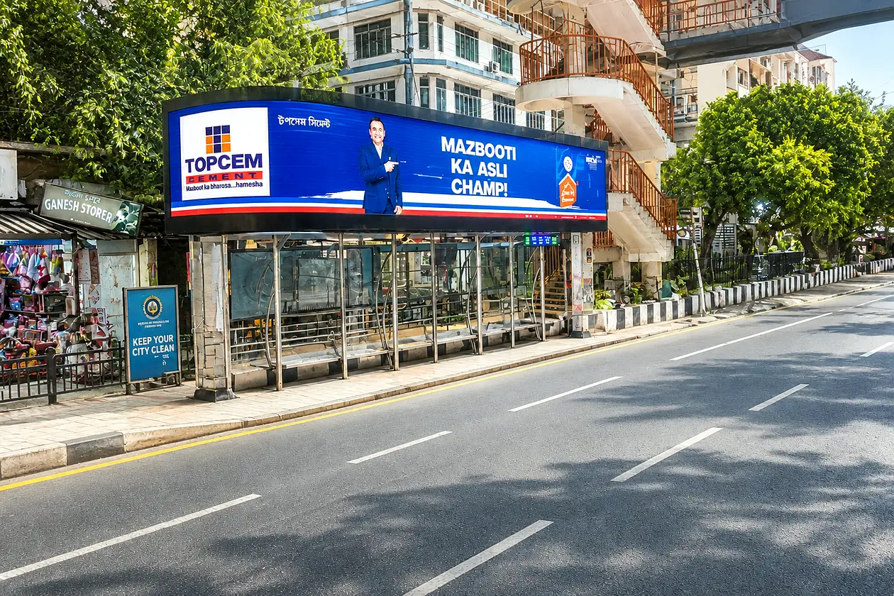 Topcem Cement digital bus shelter ad in Guwahati, by day