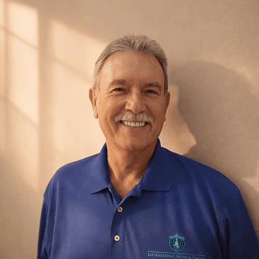 Dr. Michael, senior physician smiling in healthcare clinic