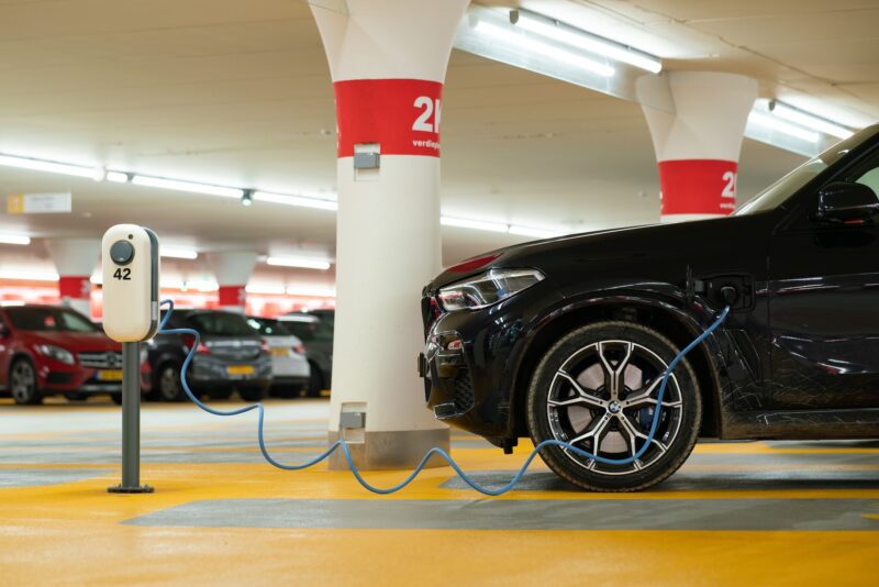 A public electric car charger in a garage