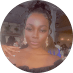 woman holding her hips while smiling