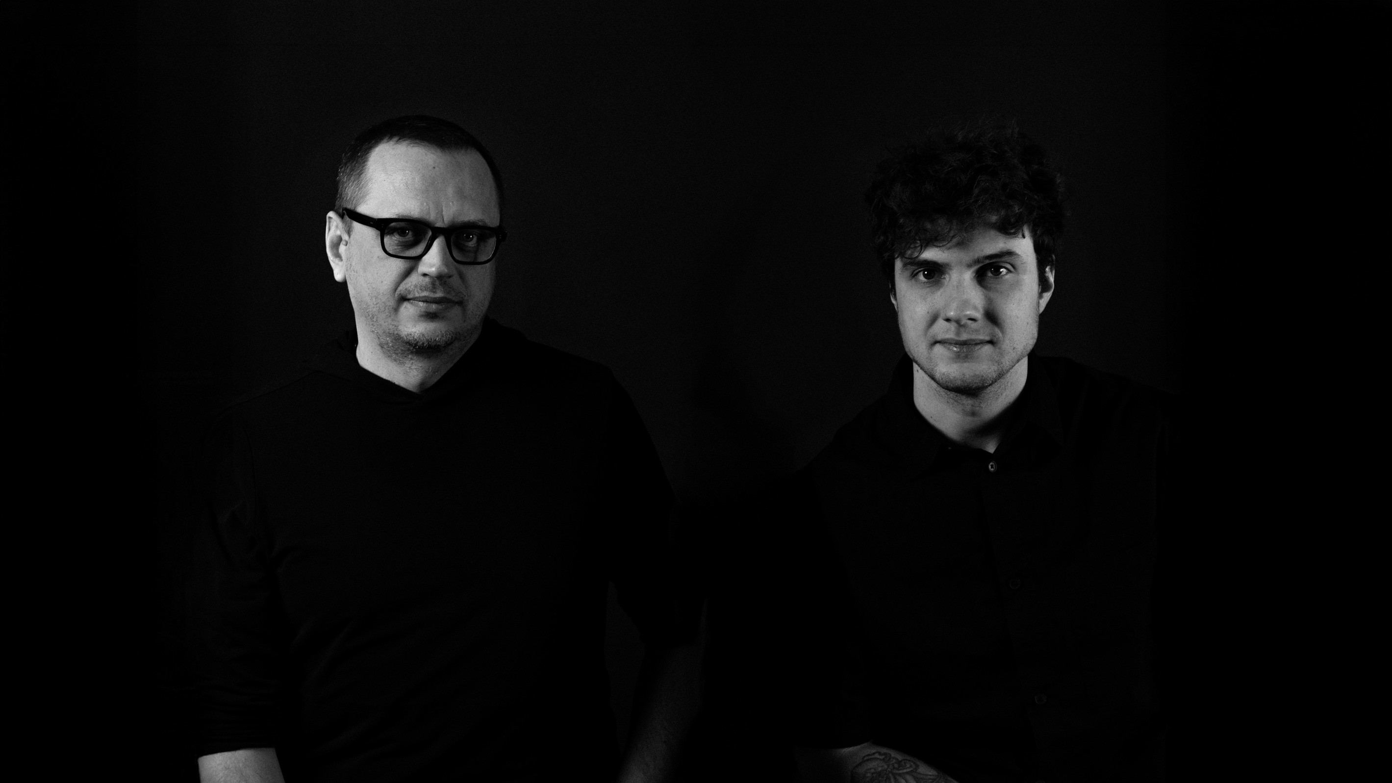 People celebrating, red stickers floating in the air