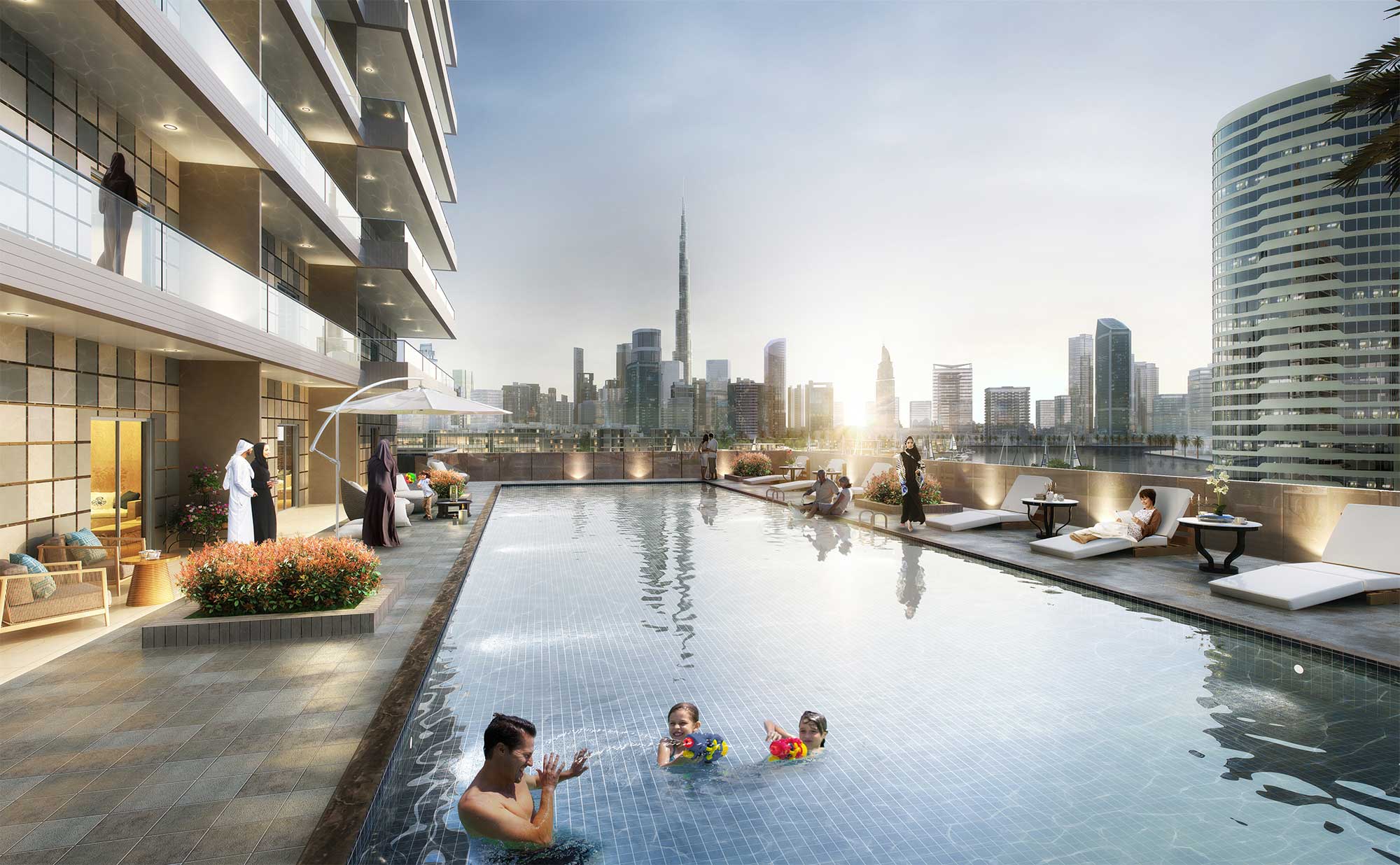 Outdoor swimming pool at Elite Business Bay Residence with a view of the Burj Khalifa and Dubai skyline.