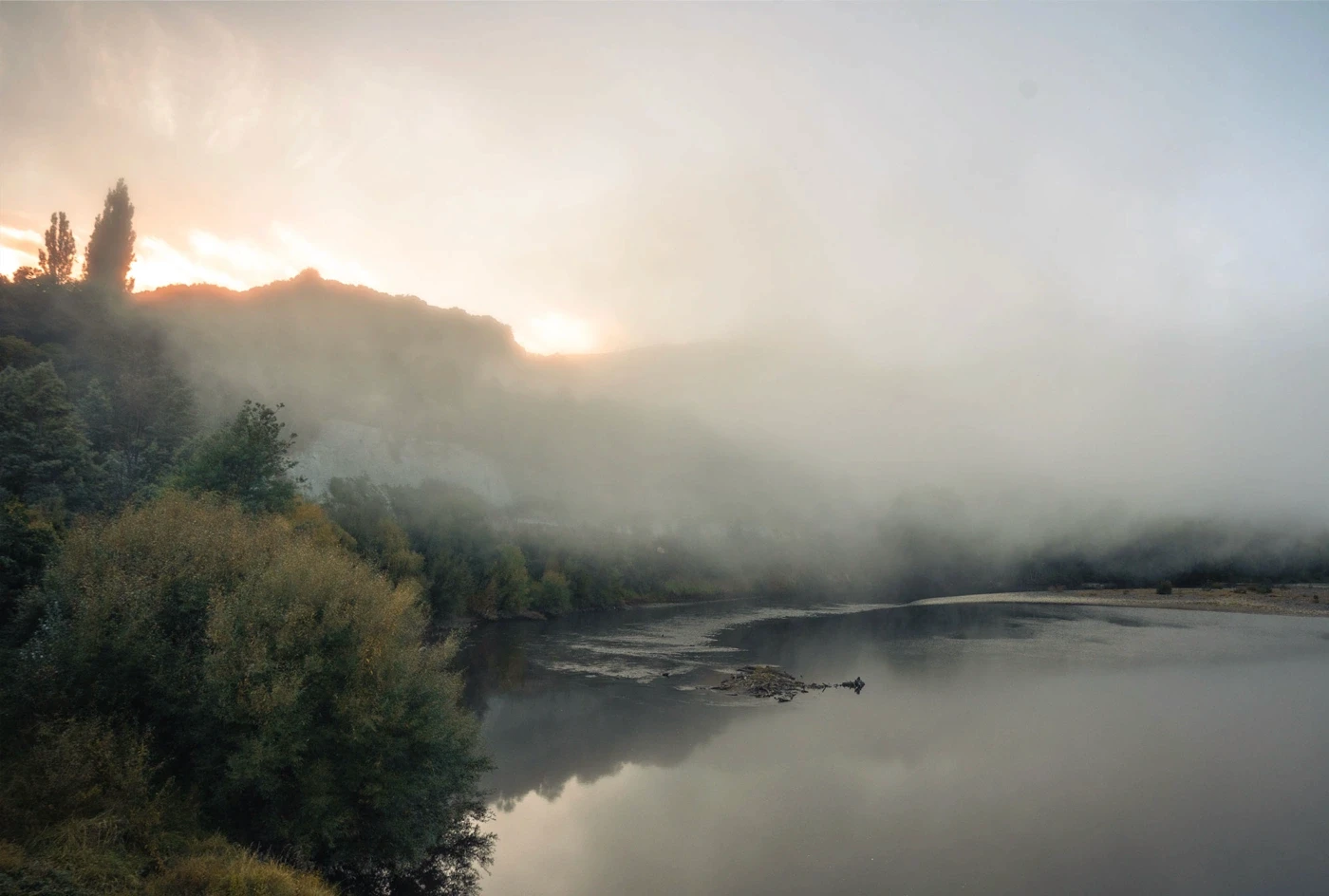 Mist over a river landscape
