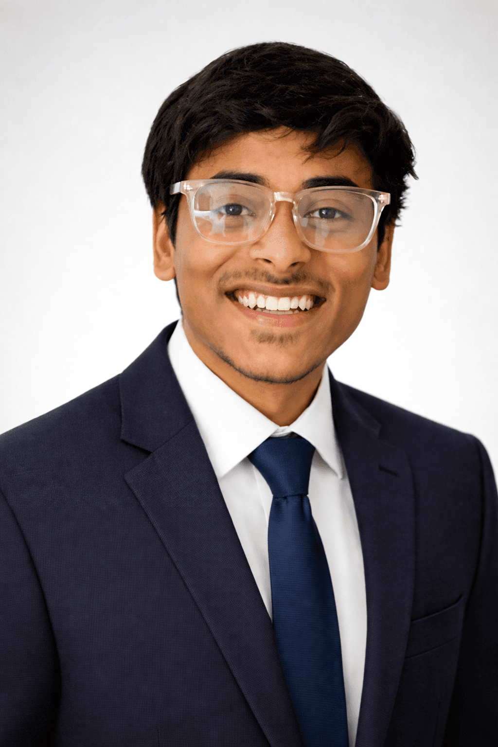 man in green crew neck t-shirt wearing black framed eyeglasses