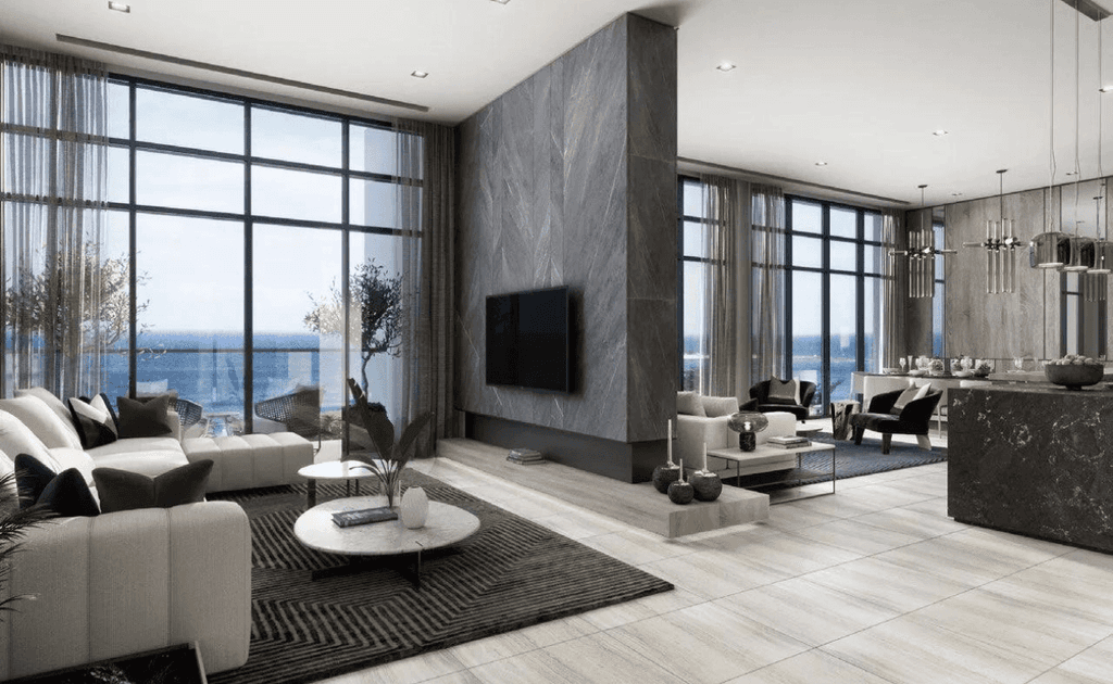 Elegant living room with a large window revealing an ocean vista, created by Anwa Aria by Omniyat.